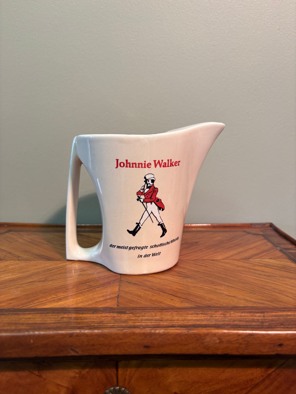 Vintage mid-century Johnnie Walker ceramic pub water jug featuring German branding
